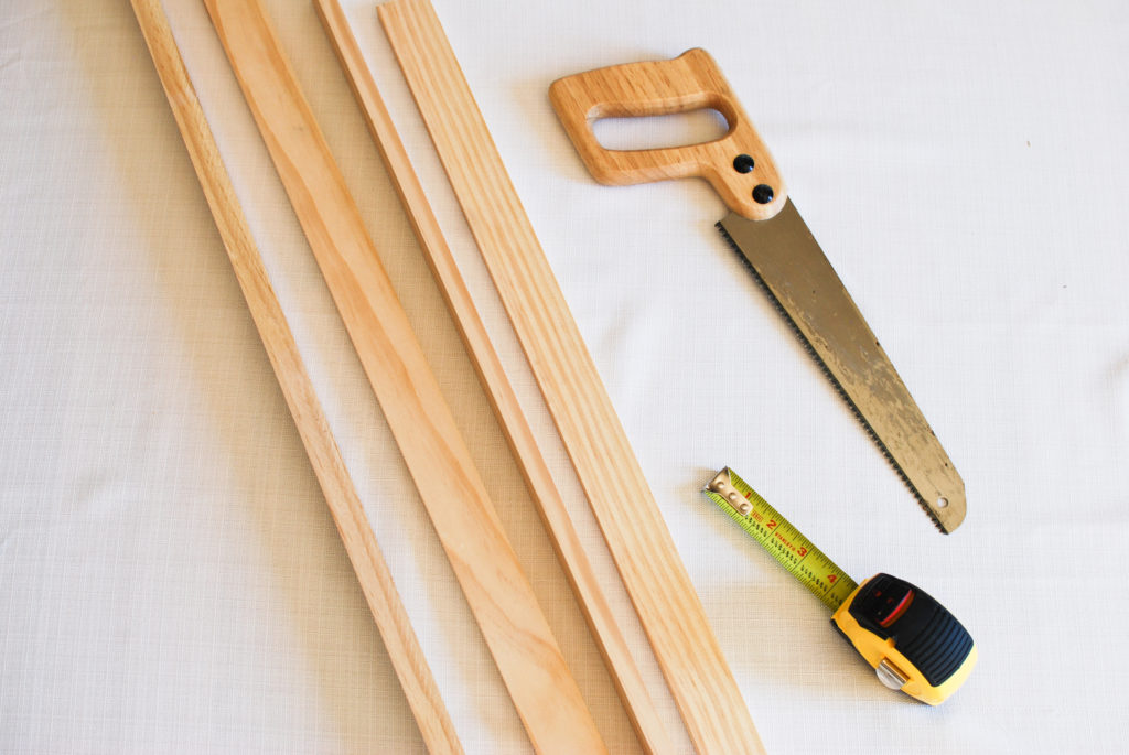 Wood pieces with saw and tape measure